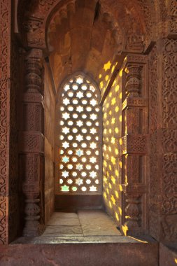 Qutb Minar, Delhi, window gives a beautiful light like stars clipart