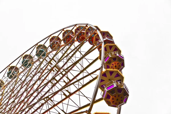 Big wheel in motion with dark clouds — Stock Photo, Image