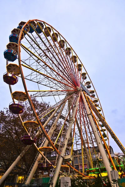 Big wheel in motion with dark clouds — Stock Photo, Image