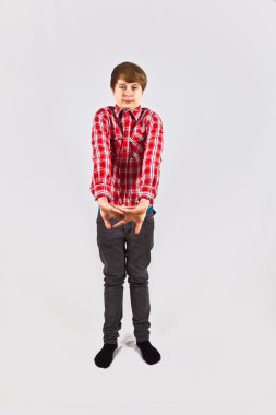 Friendly looking young boy with red shirt