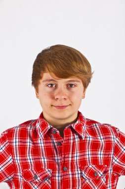 Friendly looking young boy with red shirt