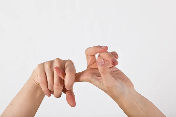 Zenske ruka je zobrazen v gestu jógy — Stock fotografie