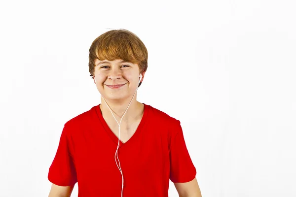Boldog fiú hallgató-hoz zene keresztül fejhallgató — Stock Fotó