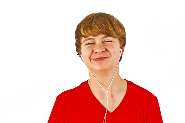 Boldog fiú hallgató-hoz zene keresztül fejhallgató — Stock Fotó