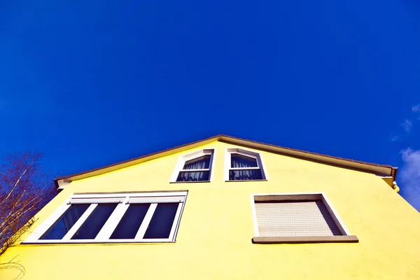 Facade of house with blue sky Stock Picture