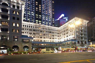 Hong Kong famous luxury Hotel Peninsula by night clipart