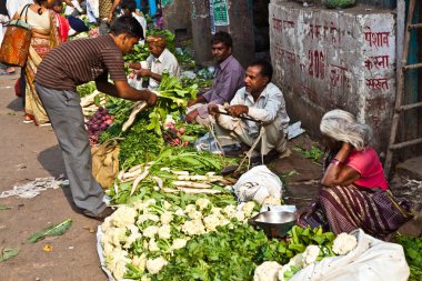 sell vegetables at Chawri Bazar in Delhi, India clipart