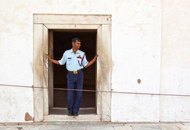 Guard pays attention at hall of Private Audience or Diwan I Khas clipart