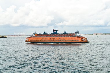 Staten Island Ferry is cruising in the bay clipart