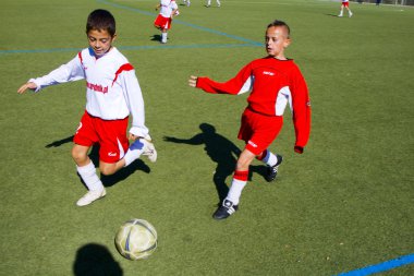 Children of BSC SChwalbach playing soccer clipart