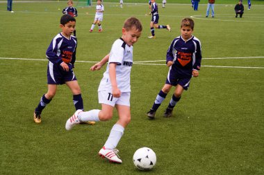 Children of BSC SChwalbach playing soccer clipart