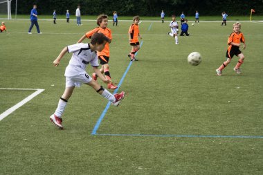 Children of BSC SChwalbach playing soccer clipart