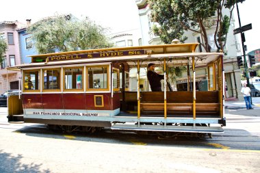 Cable Car passes the Powell street in rush hour clipart