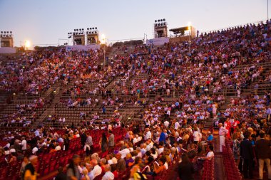 are watching the opening of the opera in the arena of ver clipart