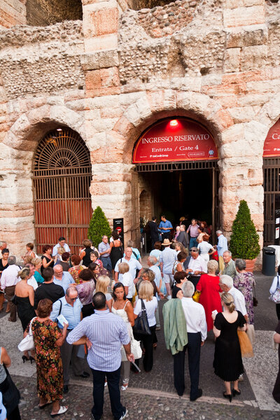 Visitors, spectators are waiting outside the arena di verona for