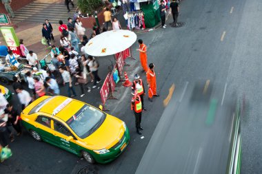 Security Guard at the main road is regulating the traffic clipart