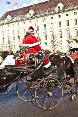 Horse drawn fiaker at the Hofburg for tourists in Vienna clipart