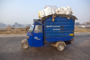 Cargo rickshaw on the Highway clipart
