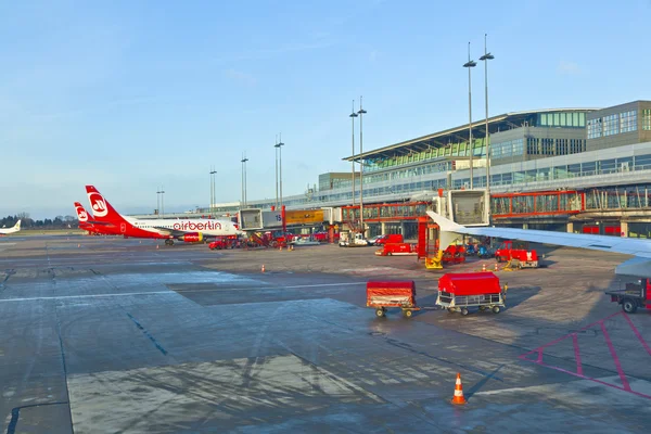 stock image Aircraft at the finger in the modern Terminal 2