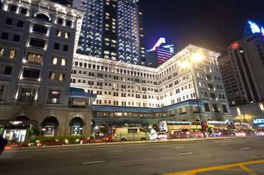 Hong Kong famous luxury Hotel Peninsula by night clipart