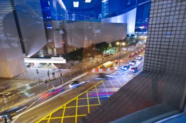 Cars passing the Salisbury road by night in kowloon, Hong Kong clipart