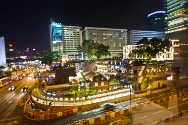 Cars passing the Salisbury road by night in kowloon, Hong Kong clipart