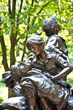 Memorial statues to Vietnam war Women Nurse clipart