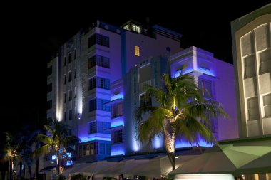 Night view at Ocean drive on in Miami Beach in the art deco dist clipart