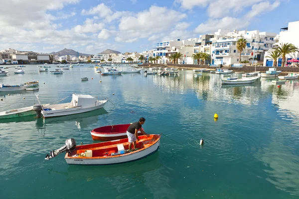 stock image Fisherman anchors the boat in Charco de San Gines