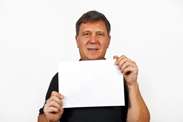 Smart man holding an empty poster in his hand — Stock Photo, Image