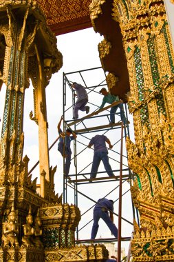 Worker renovate the temple in the Grand palace clipart