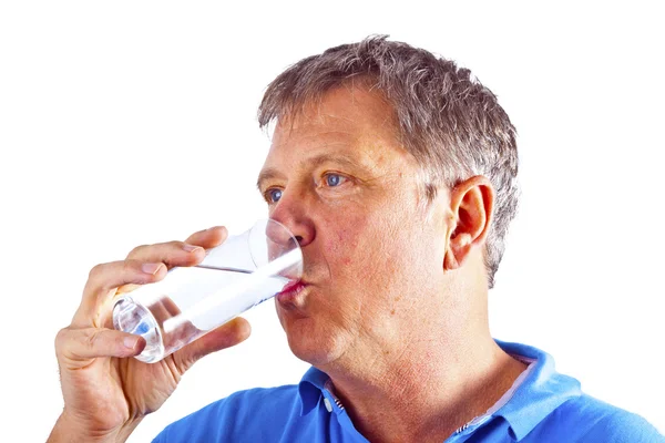 Man drinking water out of a glass — Stock Photo, Image