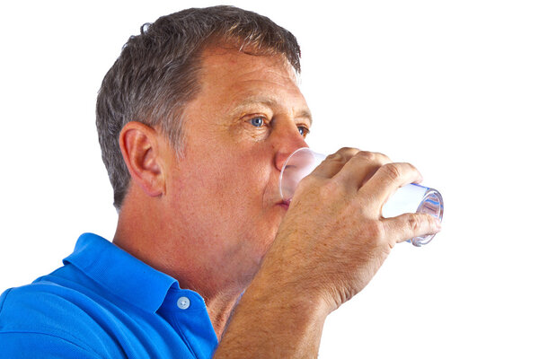 Man drinking water out of a glass