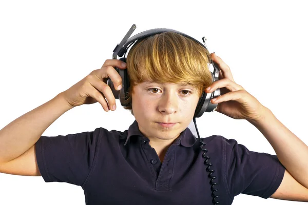 Çocuk kulaklık ile müzik dinlemek sahiptir. — Stok fotoğraf