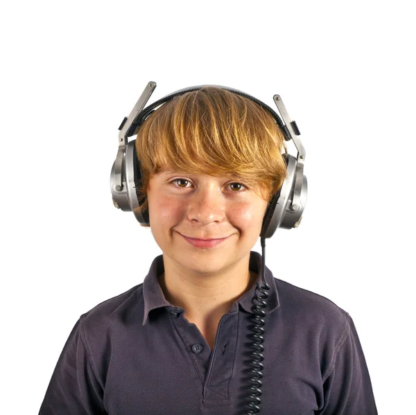 Çocuk kulaklık ile müzik dinlemek sahiptir. — Stok fotoğraf