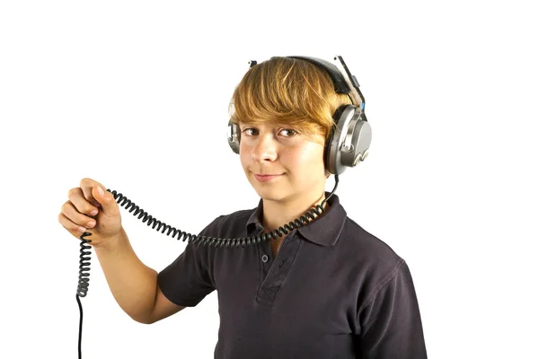 Boy enjoys listening to music with headphones — Stock Photo, Image