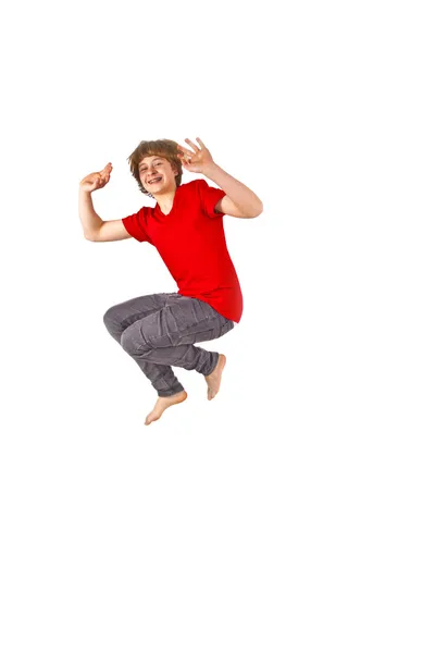 Porträtt av tonårig pojke hoppar i luften — Stockfoto