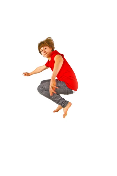 Porträtt av tonårig pojke hoppar i luften — Stockfoto