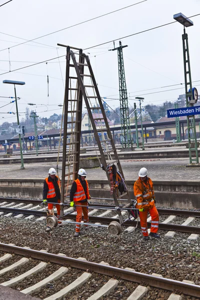 stock image Worker repair the catenary in the station