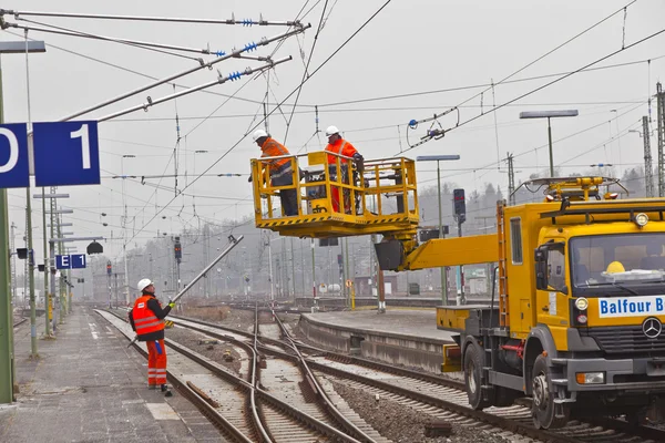 stock image Worker repair the catenary in the station