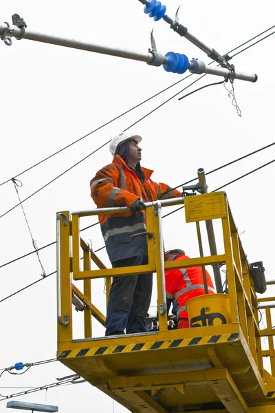 stock image Worker repair the catenary in the station