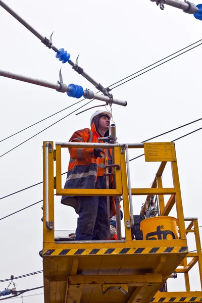 stock image Worker repair the catenary in the station