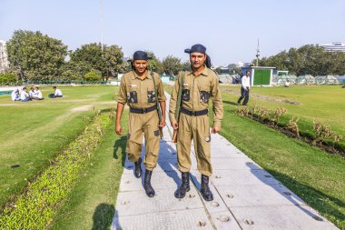 Policemen guard Connaught Place clipart