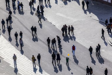 walking at the street with long shadows clipart