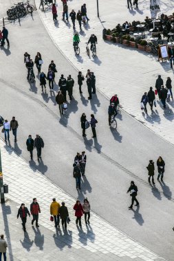 walking at the street with long shadows clipart