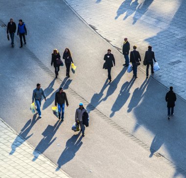 walking at the street with long shadows clipart