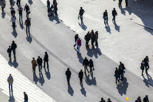 Walking at the street with long shadows — Stock Photo, Image