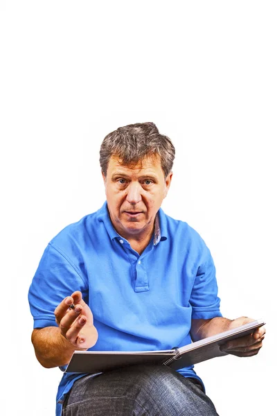 Man writing in a book — Stock Photo, Image