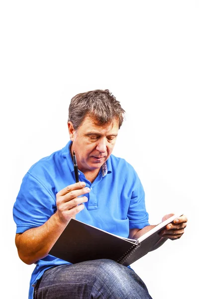 Man writing in a book — Stock Photo, Image