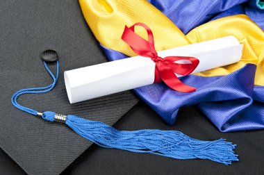 Graduation cap and diploma clipart